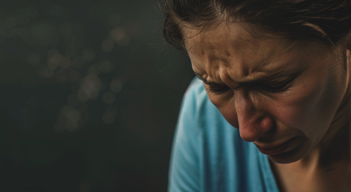 Woman Crying, Learning about treatment options for treatment-resistant depression at American TMS Clinics. Discover new hope and treatments for those who haven’t found relief from usual therapies.